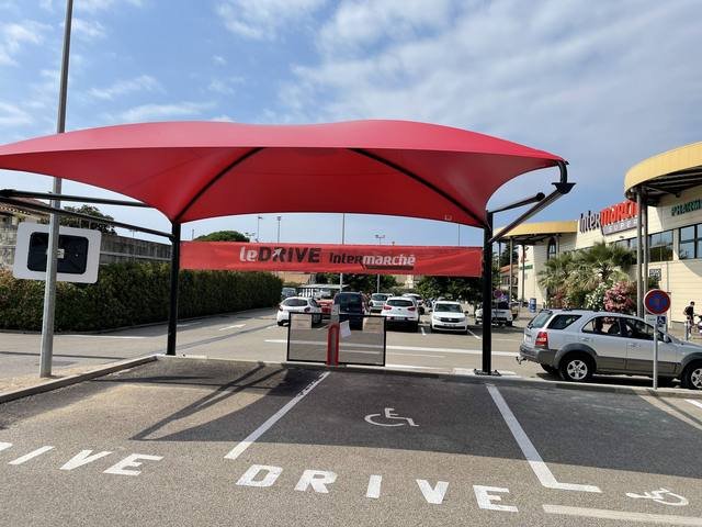 Impression grand format — Le Drive Monaché : habillage parasol drive supermarche